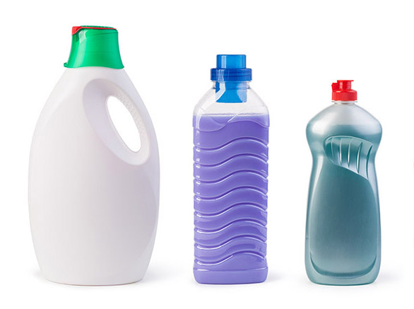 Three plastic blow moulded bottles set up in a line on a white background
